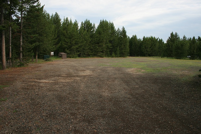 There is a large parking area in the center of the campsite loop for extra vehicles and RVs.
Notice the garbage dumpster on the left side of the parking area.