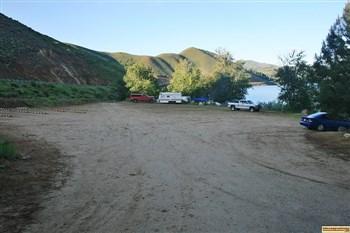 Campsites 1 & 2 are lotaced along the right side of this parking lot in Curlew Creek Boat Ramp & Campground on Anderson Ranch Reservoir.