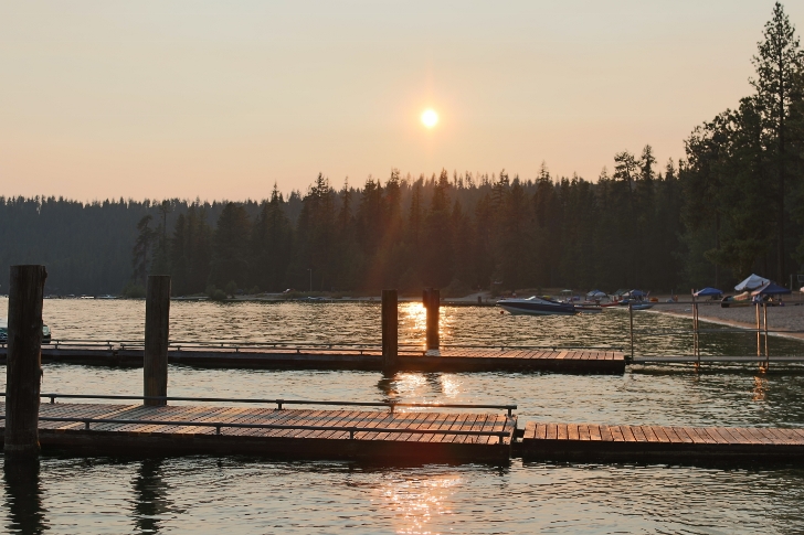 The docks and beach on a smokey evening. 
