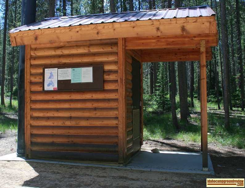Cute log outhouse in Lola Creek Campground.